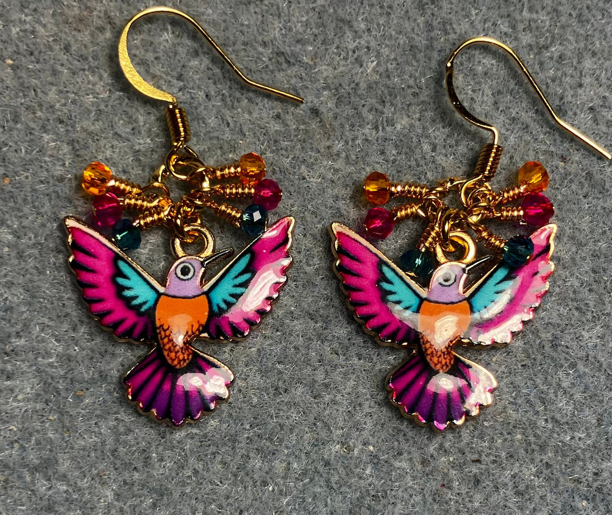 Hot pink, orange, and turquoise enamel hummingbird charm earrings adorned with tiny dangling hot pink, orange, and turquoise Chinese crystal beads.