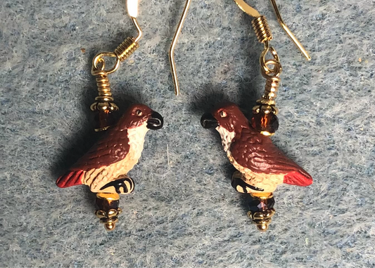 Small brown, red, and tan ceramic red tailed hawk bead earrings adorned with brown Chinese crystal beads.