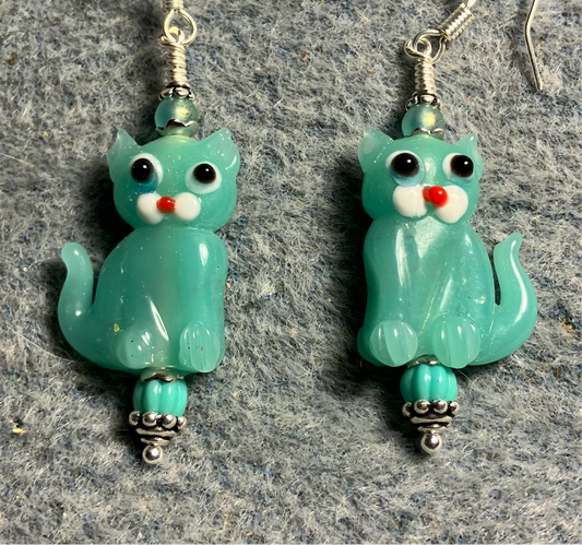Milky turquoise lamp work cat bead earrings adorned with turquoise Czech glass beads.