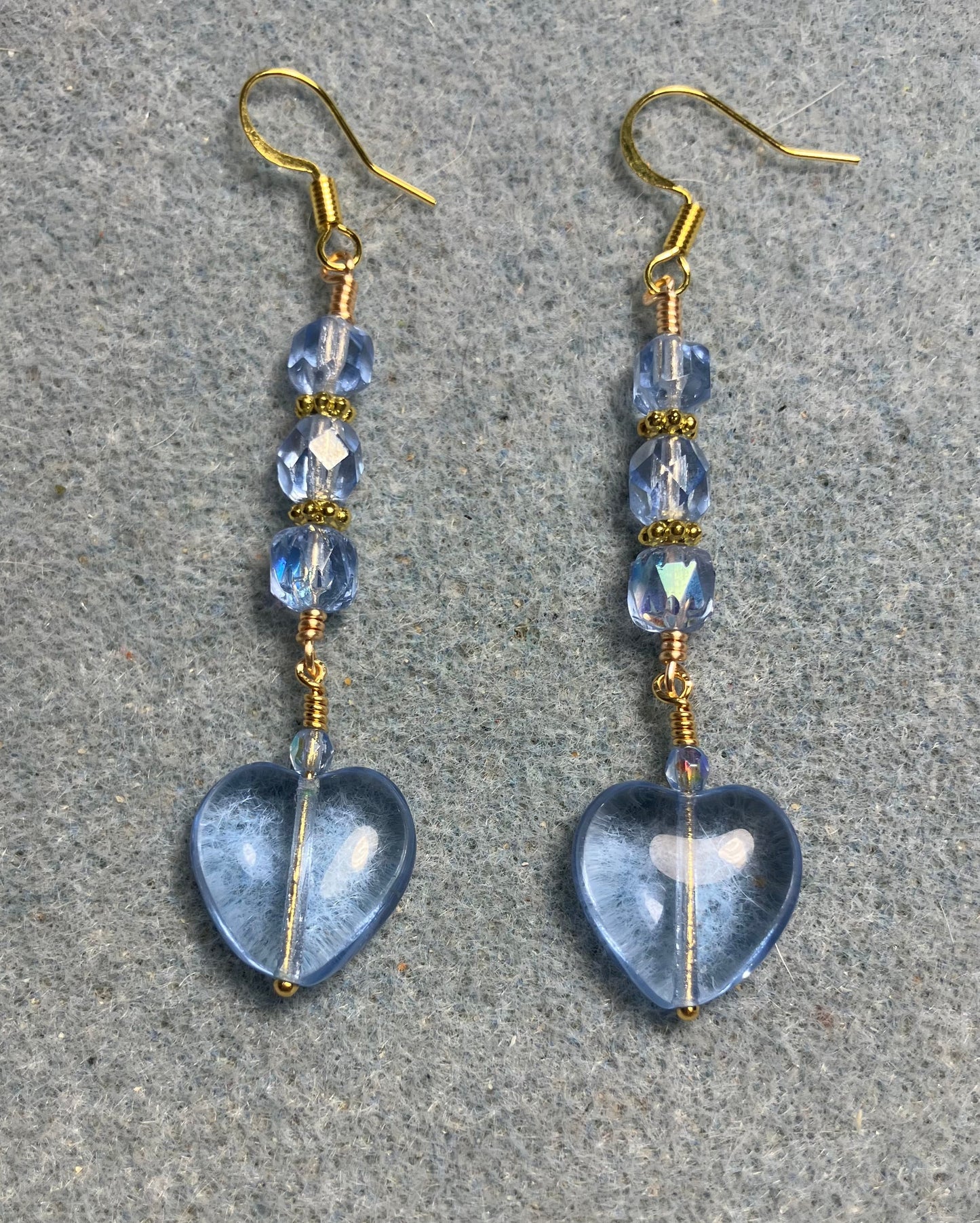 Light blue Czech glass heart bead earrings adorned with light blue Czech glass beads.