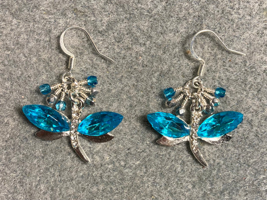 Turquoise and silver rhinestone dragonfly charm earrings adorned with small dangling turquoise and silver Czech glass beads.