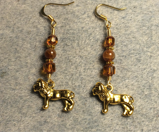 Gold lion charm earrings adorned with topaz Czech glass beads and topaz agate beads