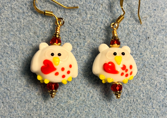 White, yellow, and red lamp work Valentine’s Day owl bead earrings adorned with red Chinese crystal beads.