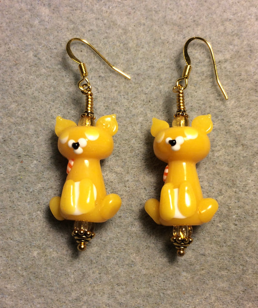 Opaque golden yellow lamp cat bead earrings adorned with amber Czech glass beads.