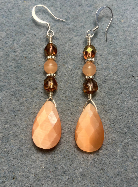 Peach fiber optic briolette bead earrings adorned with peach Czech glass beads.