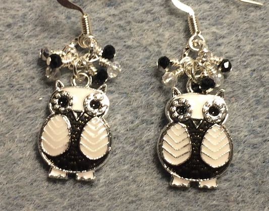 Black and white enamel owl charm earrings adorned with tiny dangling black, silver, and clear Chinese crystal beads.