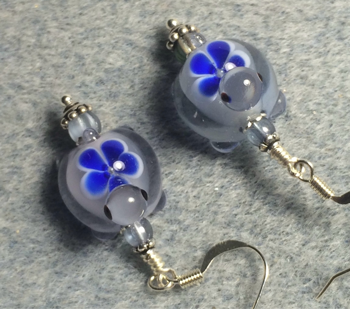 Light blue and dark blue lamp work turtle bead earrings adorned with light blue Czech glass beads.