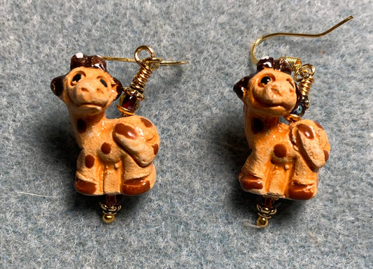 Small orange and brown ceramic spotted giraffe bead earrings adorned with amber Chinese crystal beads.