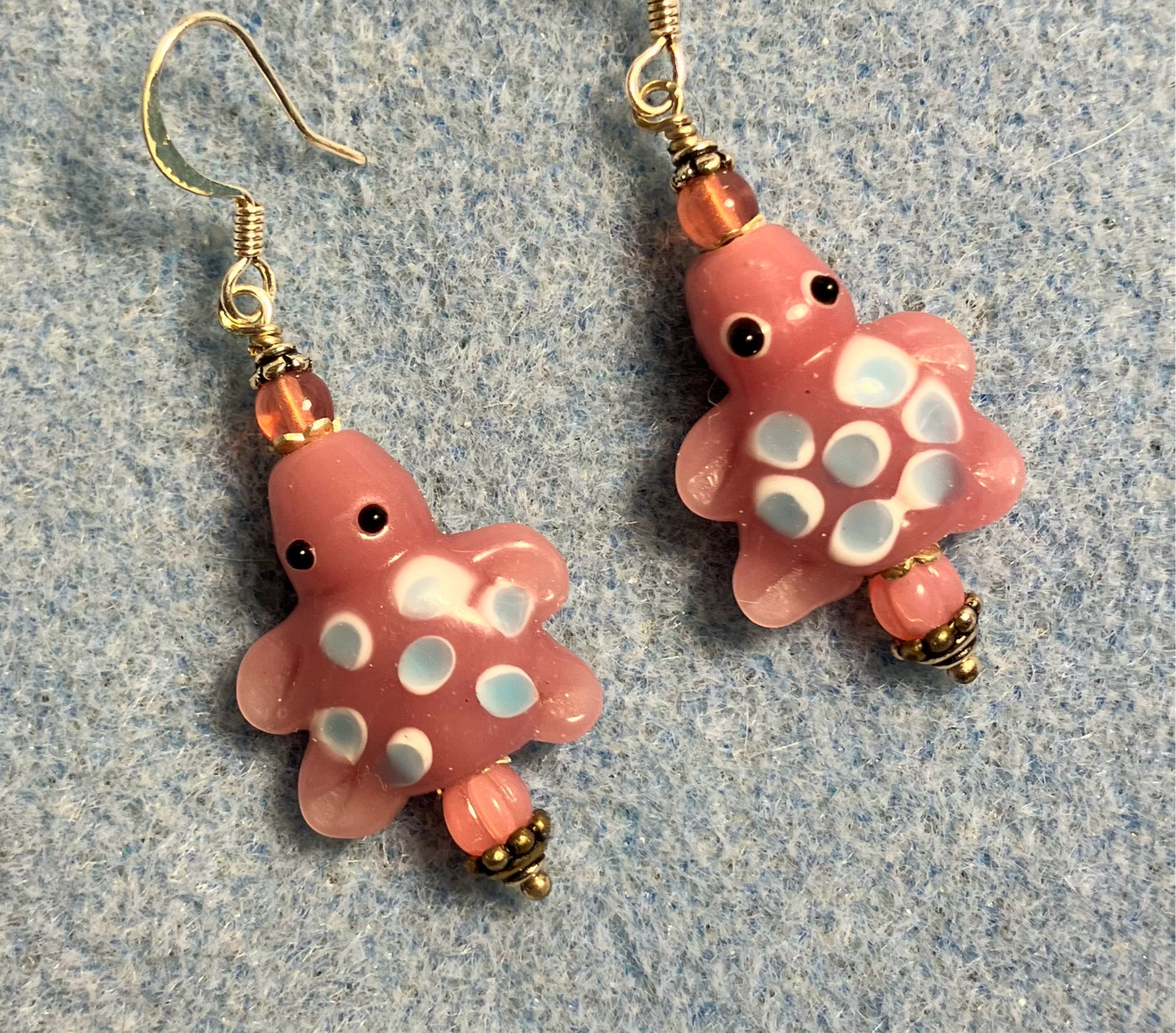 Pink with blue spots lamp work turtle bead earrings adorned with pink Czech glass beads.