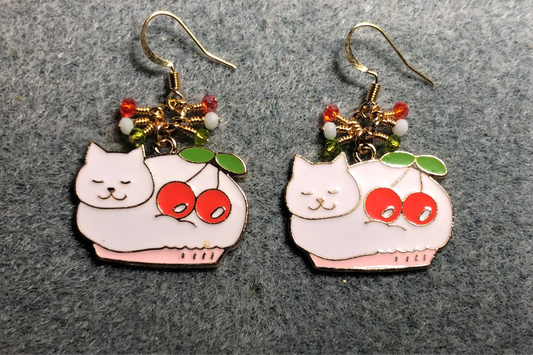 White, red, and green enamel cat charm earrings adorned with tiny dangling white, red, and green Chinese crystal beads.