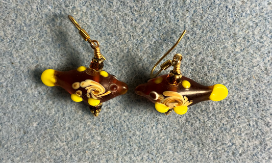 Dark red lamp work fish bead earrings adorned with dark red Chinese crystal beads.