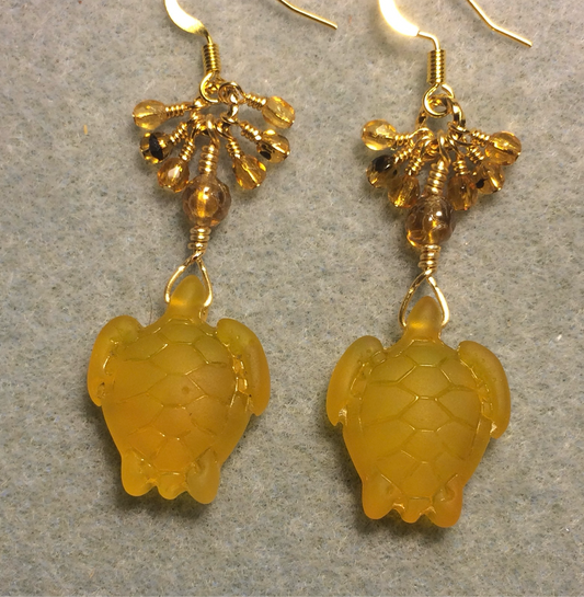 Amber sea glass sea turtle bead earrings adorned with amber Czech glass beads and small dangling amber Czech glass beads.