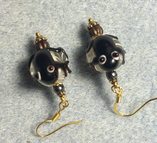 Brown lamp work frog bead earrings adorned with brown Czech glass beads.