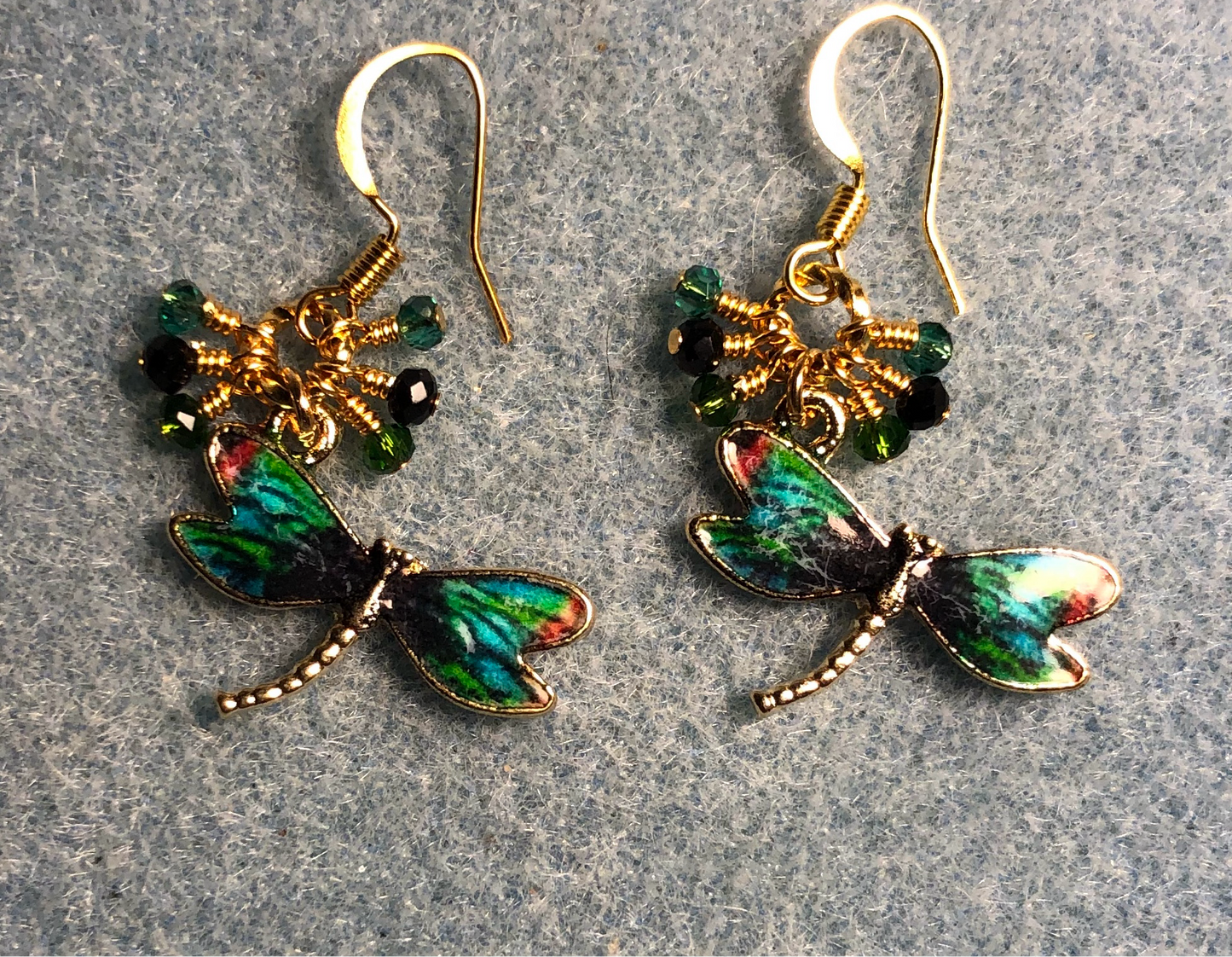 Green, black, and aqua enamel dragonfly charm earrings adorned with tiny dangling green, black, and aqua Chinese crystal beads.