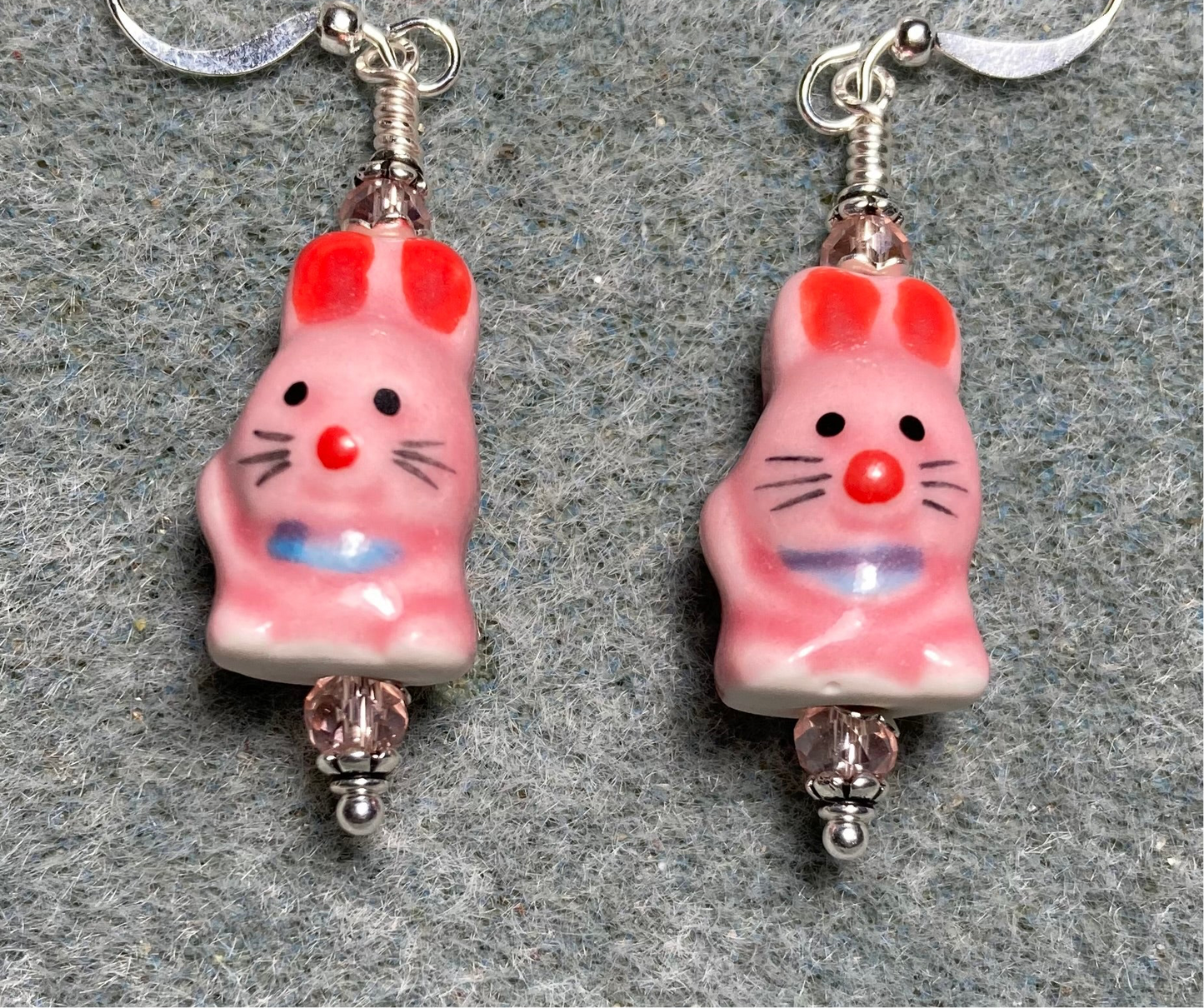 Pink and red ceramic rabbit bead earrings adorned with pink Chinese crystal beads.
